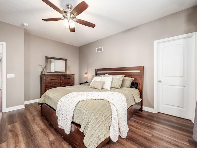 bedroom with ceiling fan and dark wood-type flooring