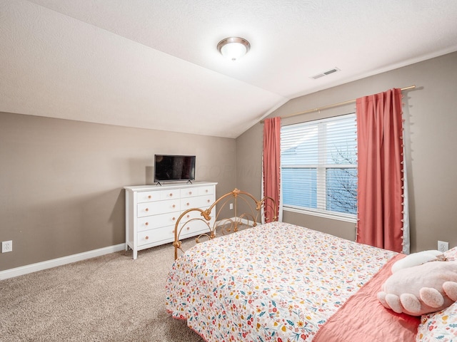 bedroom with carpet and lofted ceiling