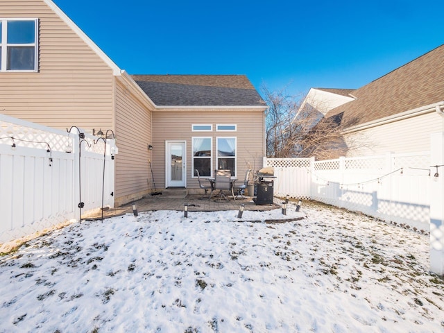 view of snow covered house