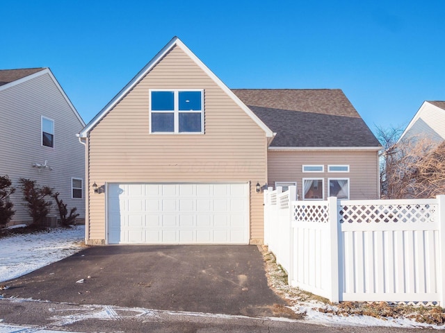 view of front of property with a garage