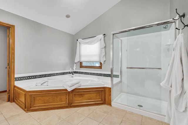 bathroom with shower with separate bathtub, lofted ceiling, and tile patterned floors