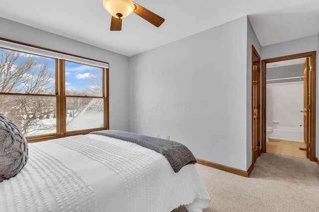 carpeted bedroom with ceiling fan, a closet, and connected bathroom