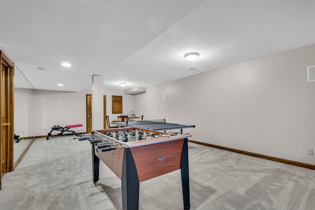 recreation room with light colored carpet