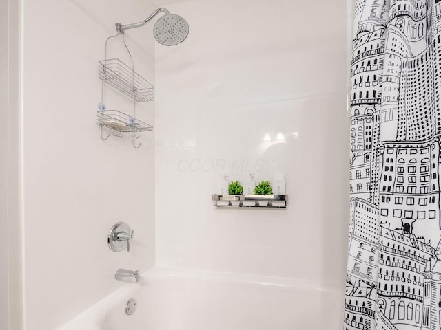 bathroom with shower / tub combo with curtain