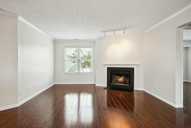 unfurnished living room featuring rail lighting, a textured ceiling, dark hardwood / wood-style floors, and ornamental molding