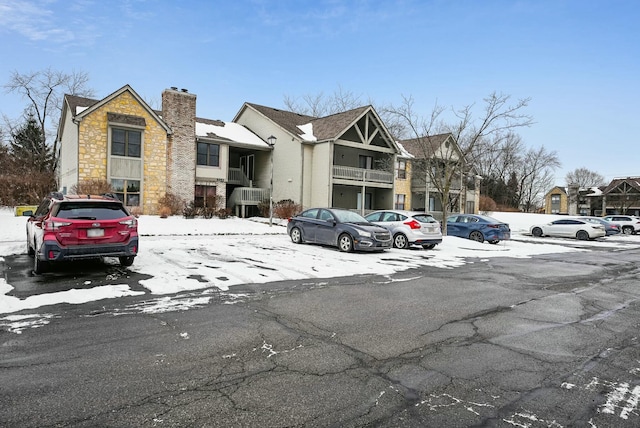 view of snow covered parking