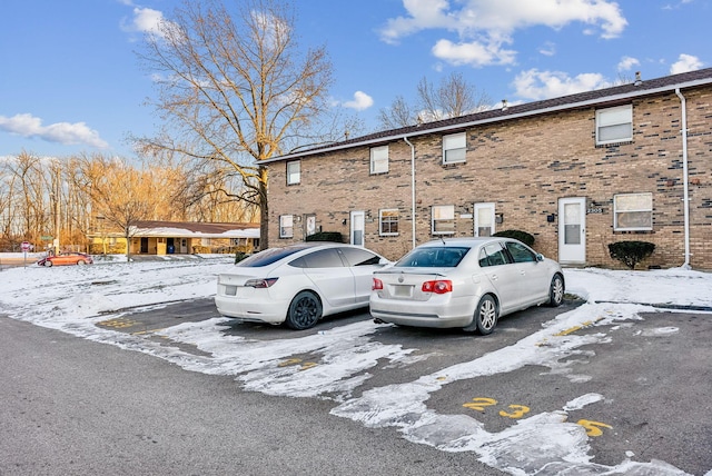 view of snow covered parking