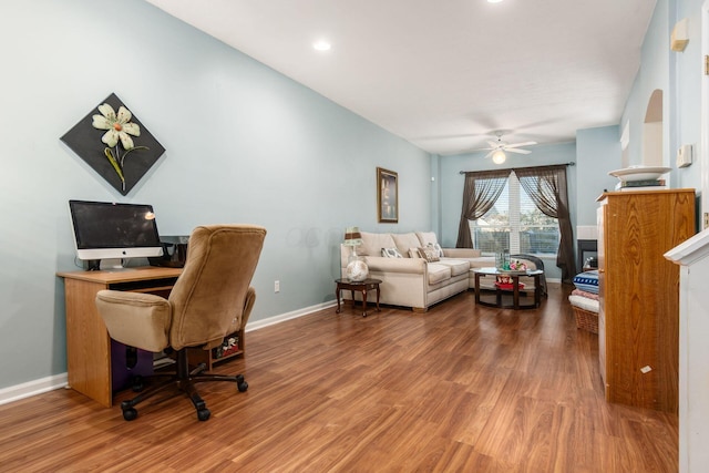 home office with hardwood / wood-style flooring and ceiling fan