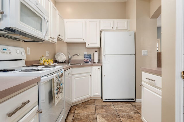 kitchen with white cabinetry, sink, and white appliances