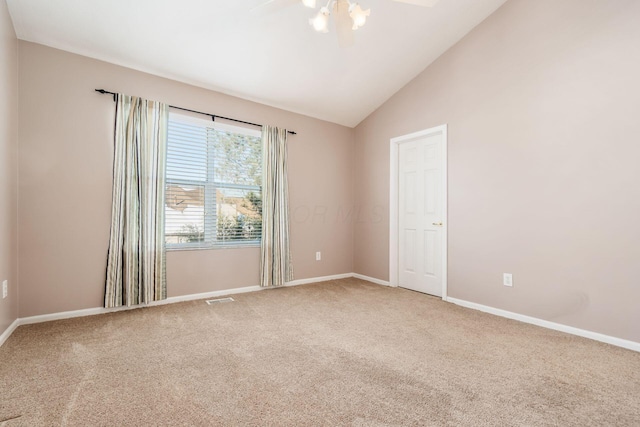 unfurnished room with ceiling fan, carpet floors, and lofted ceiling