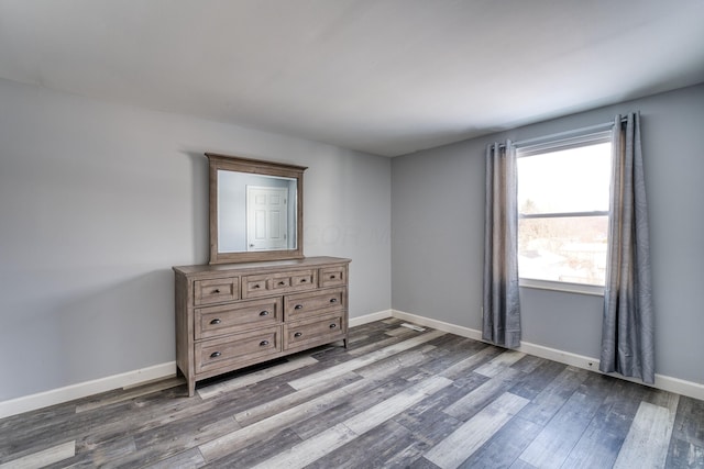 unfurnished bedroom featuring hardwood / wood-style flooring