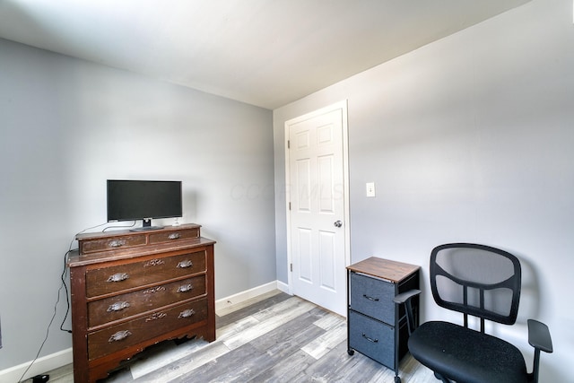 sitting room featuring light hardwood / wood-style floors