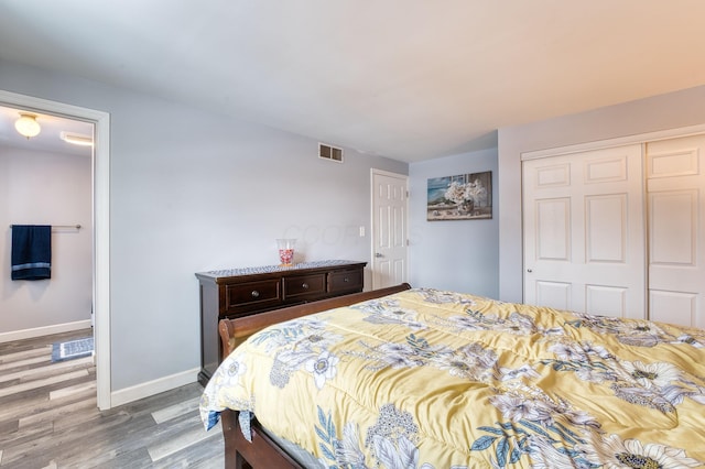 bedroom featuring a closet and hardwood / wood-style flooring