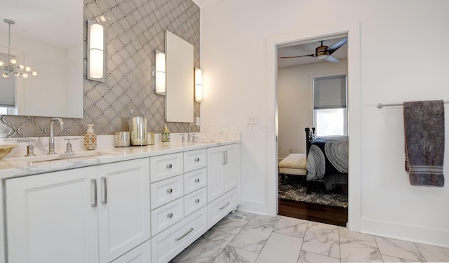 bathroom featuring ceiling fan and vanity