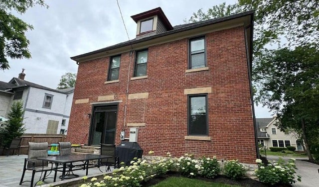 rear view of house with a patio