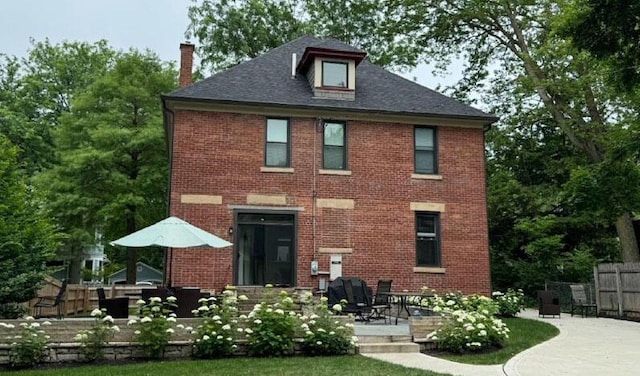 rear view of property featuring a patio