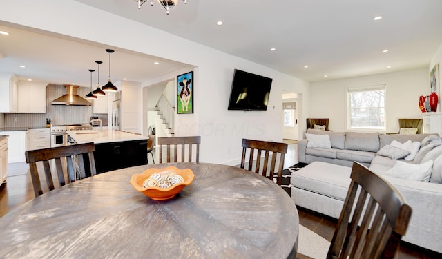 dining area with dark hardwood / wood-style flooring