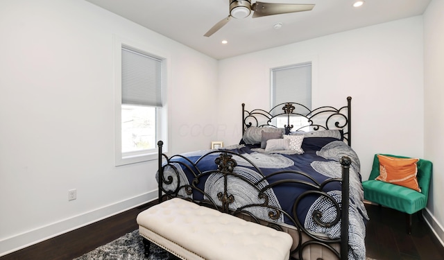 bedroom with ceiling fan and dark hardwood / wood-style floors