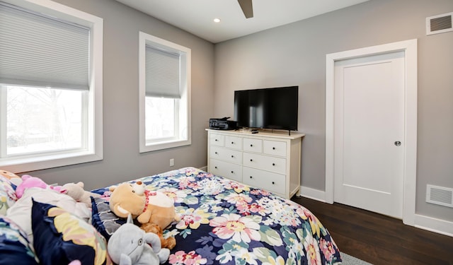 bedroom with ceiling fan and dark hardwood / wood-style floors