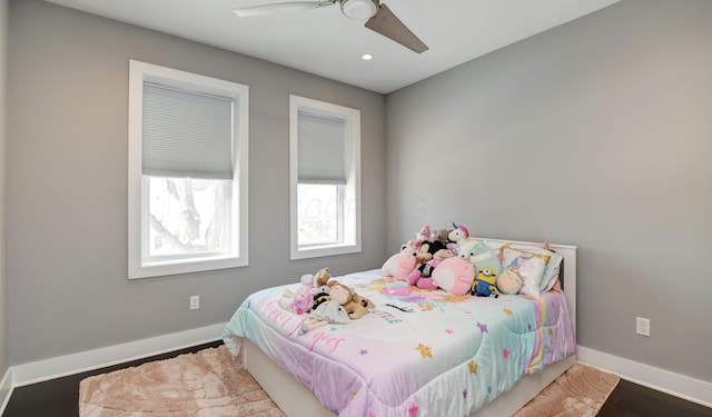 bedroom with ceiling fan and hardwood / wood-style floors