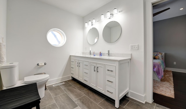 bathroom with toilet and vanity