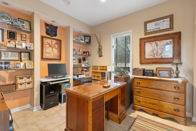 office featuring light tile patterned flooring and baseboards