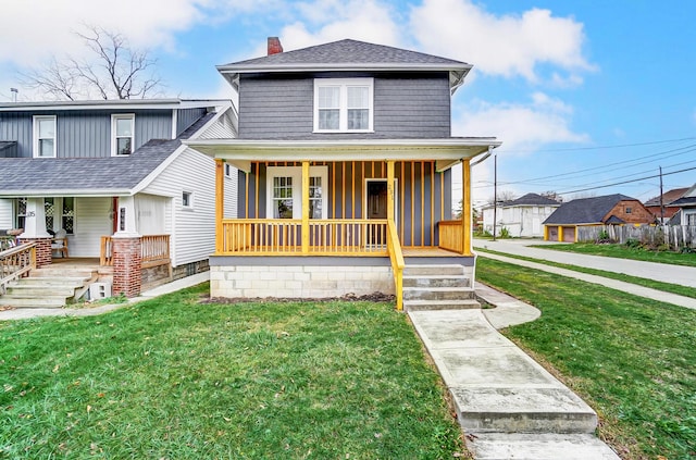 view of front of house featuring a front yard and a porch