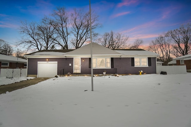 single story home featuring a garage