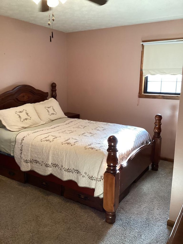 bedroom with ceiling fan and carpet flooring