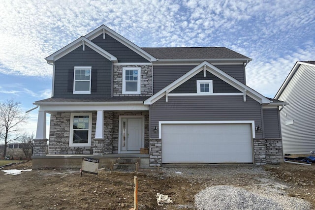 craftsman house with a garage