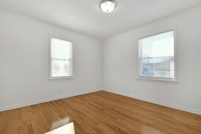 unfurnished room featuring wood-type flooring