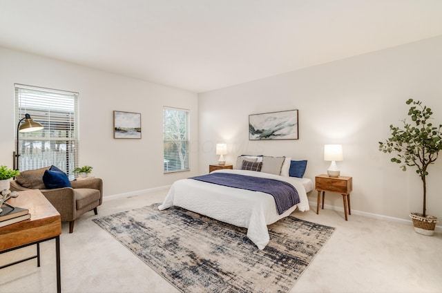 bedroom with light colored carpet