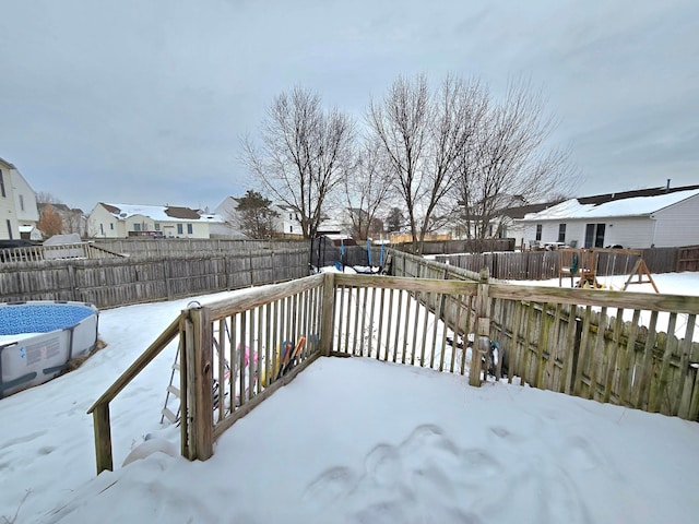 view of snow covered deck