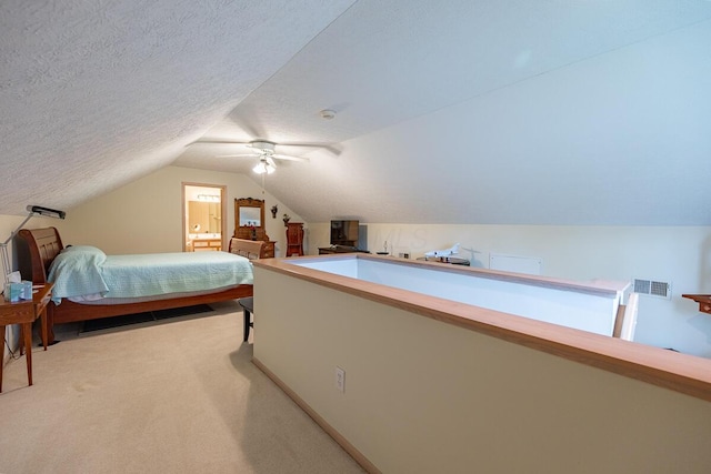 bedroom featuring lofted ceiling, ceiling fan, and light carpet