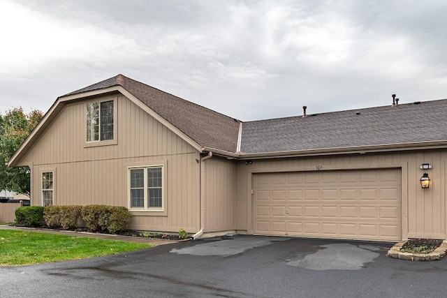 ranch-style house featuring a garage