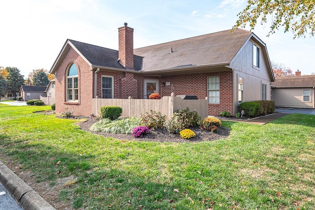 back of house with a yard