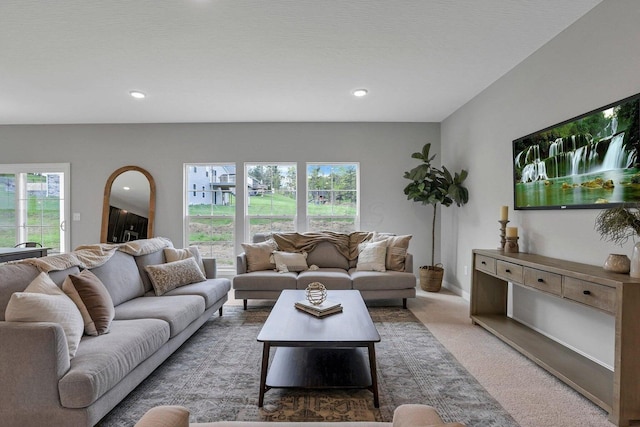 carpeted living room featuring a wealth of natural light and recessed lighting