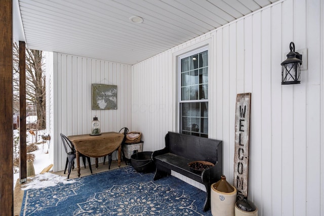 living area with wooden walls