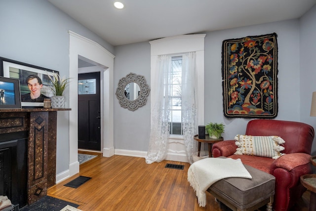 sitting room featuring wood-type flooring