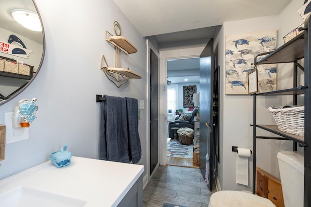 bathroom featuring vanity and toilet