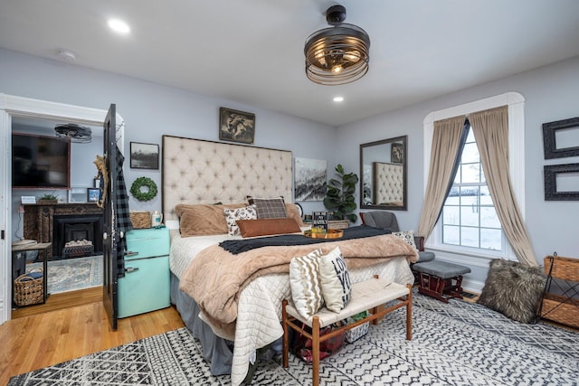 bedroom with hardwood / wood-style flooring