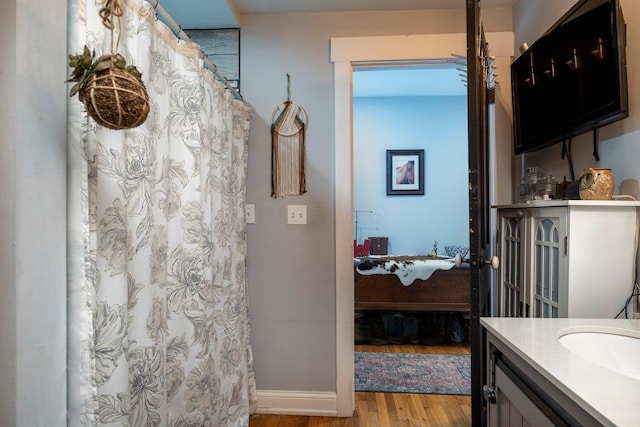 bathroom featuring vanity and hardwood / wood-style floors