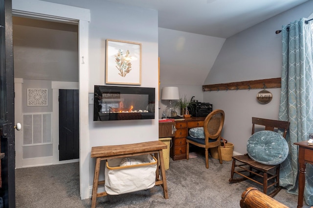 living area featuring lofted ceiling and carpet flooring