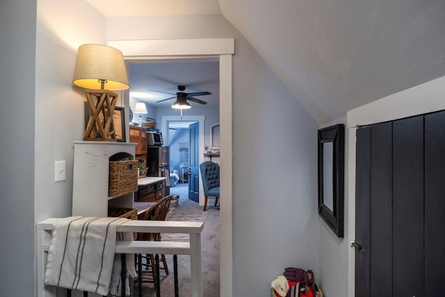 interior space with lofted ceiling and carpet flooring