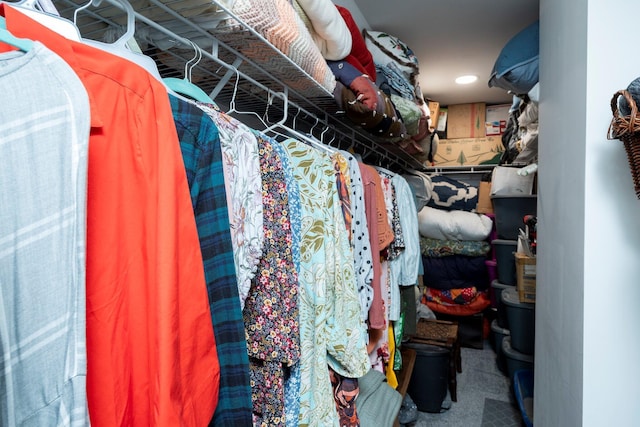 walk in closet with carpet