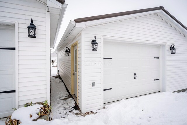 view of snow covered garage