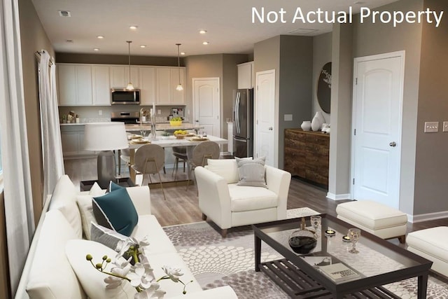 living room with light hardwood / wood-style flooring