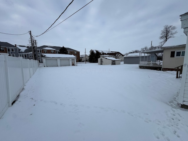 view of yard covered in snow