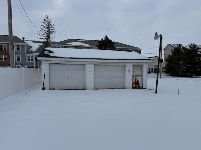 view of snow covered garage