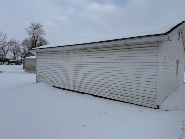 view of snow covered garage